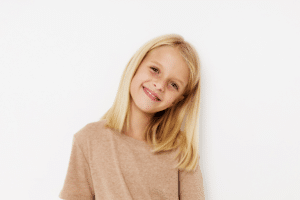 Child smiling before an orthodontic evaluation in Downey, CA
