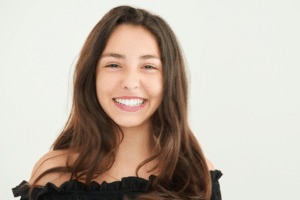 Smiling young woman displaying a bright, straight, white smile